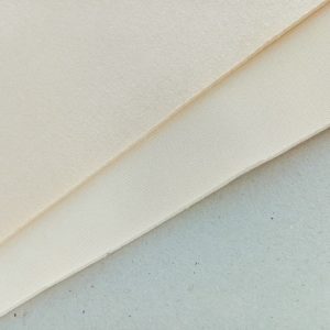 Beige laminated cut and sew foam fabric