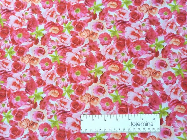 pink stretch rose print fabric with ruler