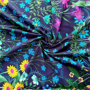 siniste ja kollaste lilledega ujumisriiete kangas