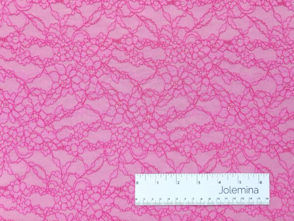 bright pink floral 4 way stretch allover lace fabric with measure tape