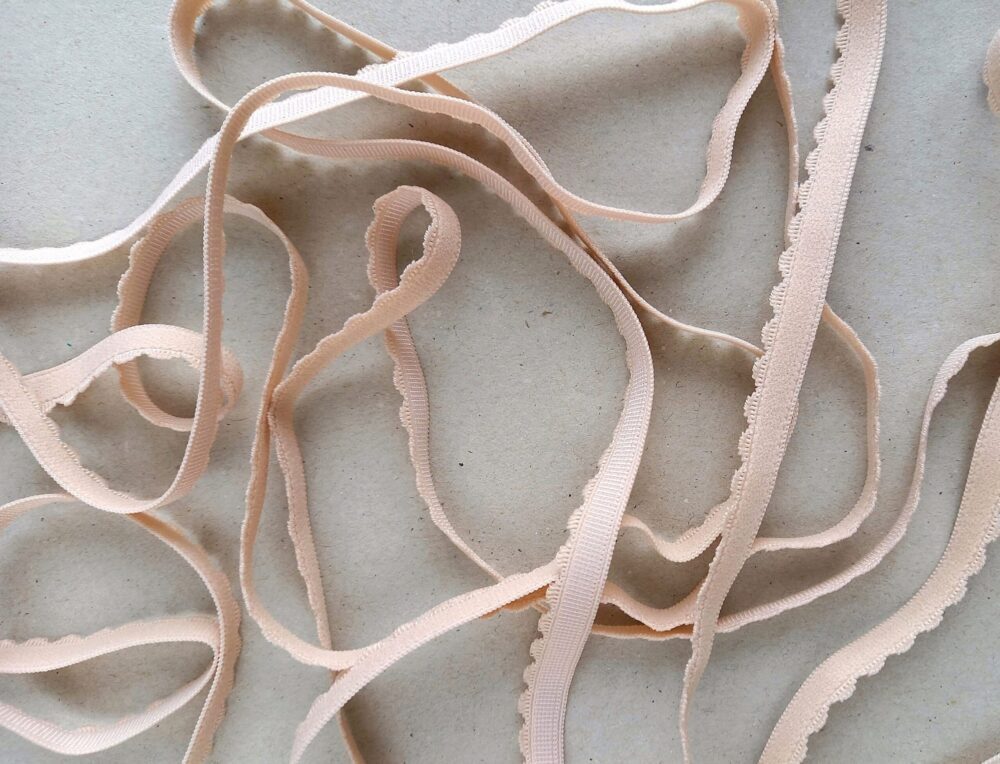 Scalloped edge elastic for lingerie, 10 mm (3/8 in) wide light skin narrow scalloped edge lingerie elastic