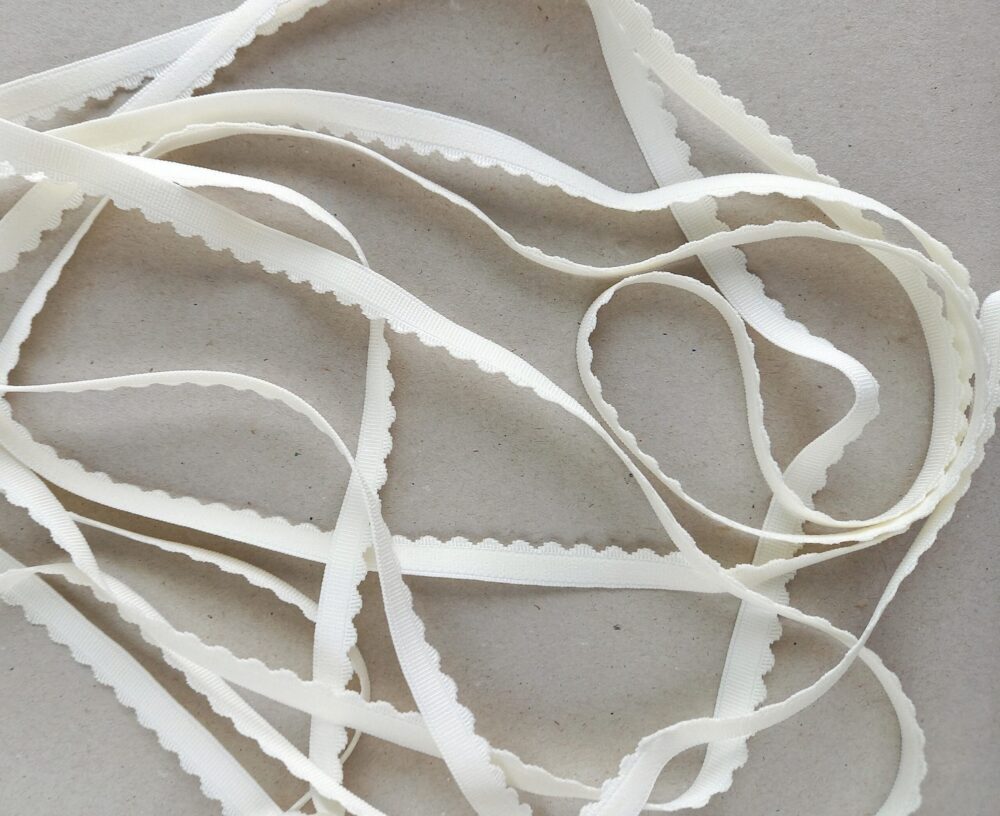 Scalloped edge elastic for lingerie, 10 mm (3/8 in) wide cream scalloped edge bra making elastic